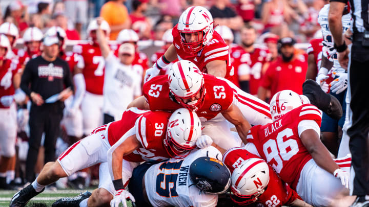 Aug 31, 2024; Lincoln, Nebraska, USA; UTEP Miners running back Corey Wren (15) is tackled by Nebraska Cornhuskers defenders during the fourth quarter at Memorial Stadium. 