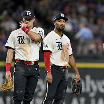 Texas Rangers third baseman Josh Jung (6) and second baseman Marcus Semien (2) and shortstop Corey Seager (5) and first baseman Josh Smith (8) during the game between the Texas Rangers and the Atlanta Braves at Globe Life Field.