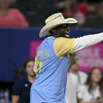 Colorado Buffalos head coach and former MLB and NFL player Deion Sanders of the National League motions to his team during the 2024 All Star Celebrity Softball Game at Globe Life Field on July 13.