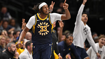 Nov 4, 2024; Dallas, Texas, USA; Indiana Pacers center Myles Turner (33) celebrates after making a three point shot against the Dallas Mavericks during the second half at the American Airlines Center. Mandatory Credit: Jerome Miron-Imagn Images