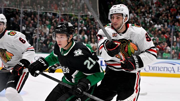 Mar 8, 2026; Dallas, Texas, USA; Dallas Stars left wing Jason Robertson (21) and Chicago Blackhawks center Frank Nazar (91) chase the puck during the second period at the American Airlines Center. Mandatory Credit: Jerome Miron-Imagn Images