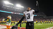 Oregon Ducks defensive back Brandon Johnson celebrates after beating the Wisconsin Badgers at Camp Randall Stadium.