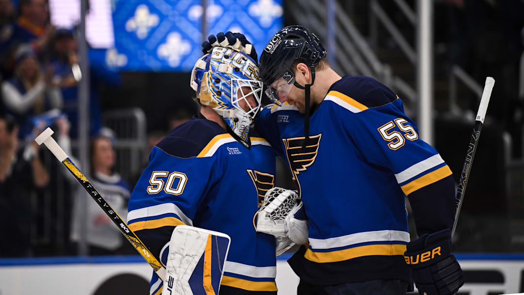 May 2, 2025; St. Louis, Missouri, USA; St. Louis Blues goaltender Jordan Binnington (50) defenseman Colton Parayko (55) celebrate after defeating the Winnipeg Jets 5-2 in game six of the first round of the 2025 Stanley Cup Playoffs at Enterprise Center. Mandatory Credit: Connor Hamilton-Imagn Images