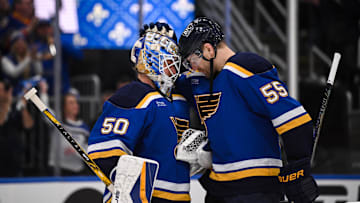 May 2, 2025; St. Louis, Missouri, USA; St. Louis Blues goaltender Jordan Binnington (50) defenseman Colton Parayko (55) celebrate after defeating the Winnipeg Jets 5-2 in game six of the first round of the 2025 Stanley Cup Playoffs at Enterprise Center. Mandatory Credit: Connor Hamilton-Imagn Images
