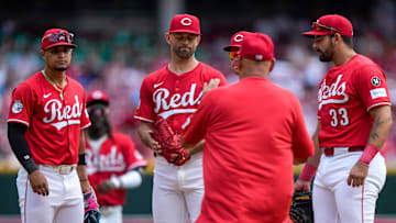 Cincinnati Reds manager Terry Francona (77) pulls pitcher Nick Martinez (28) in the third inning of the MLB interleague game between the Cincinnati Reds and the Minnesota Twins at Great American Ball Park in downtown Cincinnati on Thursday, June 19, 2025. The Twins led 9-4 after four innings.