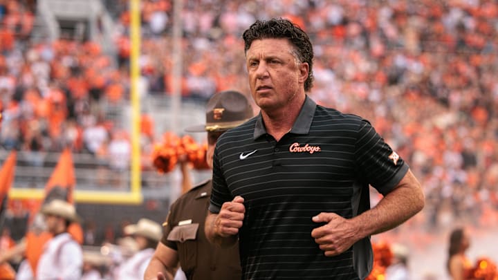 Aug 28, 2025; Stillwater, Oklahoma, USA; Oklahoma State Cowboys coach Mike Gundy takes the field prior to the game against the Tennessee Martin Skyhawks at Boone Pickens Stadium. Mandatory Credit: William Purnell-Imagn Images