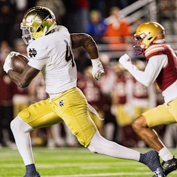Nov 1, 2025; Chestnut Hill, Massachusetts, USA; Notre Dame Fighting Irish running back Jeremiyah Love (4) runs with the ball to score a 94 yard touchdown in the fourth quarter against the Boston College Eagles at Alumni Stadium. Mandatory Credit: Edward Finan-Imagn Images