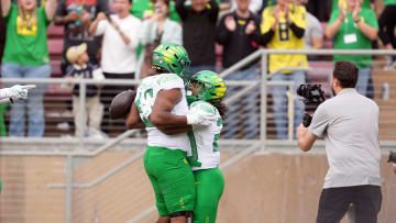 Sep 30, 2023; Stanford, California, USA; Oregon Ducks running back Jordan James (center right) celebrates with offensive lineman Ajani Cornelius (center left) after scoring a touchdown against the Stanford Cardinal during the second quarter at Stanford Stadium. Mandatory Credit: Darren Yamashita-USA TODAY Sports