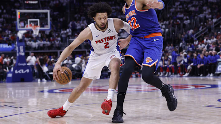 May 1, 2025; Detroit, Michigan, USA; Detroit Pistons guard Cade Cunningham (2) dribbles defended by New York Knicks center Karl-Anthony Towns (32) in the second half during game six of first round for the 2024 NBA Playoffs at Little Caesars Arena. Mandatory Credit: Rick Osentoski-Imagn Images