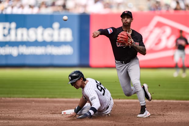 Brayan Rocchio throws a ball to second base 