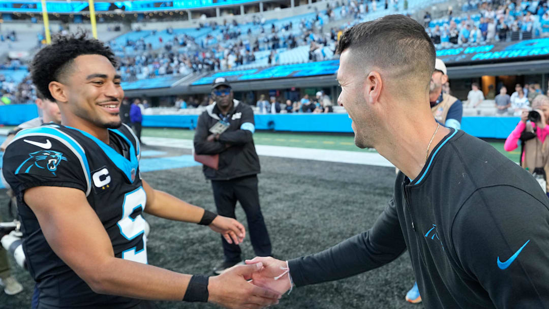 Nov 3, 2024; Charlotte, North Carolina, USA; Carolina Panthers quarterback Bryce Young (9) with head coach Dave Canales after the game at Bank of America Stadium. Mandatory Credit: Bob Donnan-Imagn Images