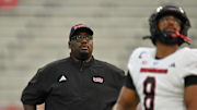 Sep 5, 2025; College Park, Maryland, USA; Northern Illinois Huskies head coach Thomas Hammock watches his team warm up.