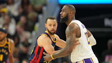 Jan 25, 2025; San Francisco, California, USA; Golden State Warriors guard Stephen Curry (left) defends against Los Angeles Lakers forward LeBron James (right) during the fourth quarter at Chase Center. Mandatory Credit: Darren Yamashita-Imagn Images