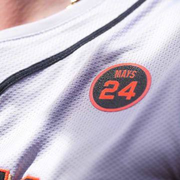 San Francisco Giants team members wear a patch to honor longtime player Willie Mays during action against the Baltimore Orioles at Oriole Park at Camden Yards on Sept 19. 