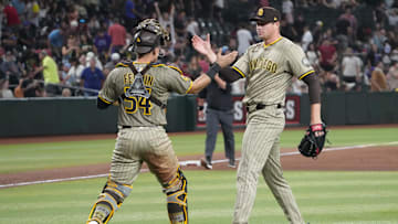 Aug 6, 2025; Phoenix, Arizona, USA; San Diego Padres catcher Freddy Fermin (54) and San Diego Padres pitcher Mason Miller (22) celebrate against the Arizona Diamondbacks after the ninth inning at Chase Field. Mandatory Credit: Joe Camporeale-Imagn Images