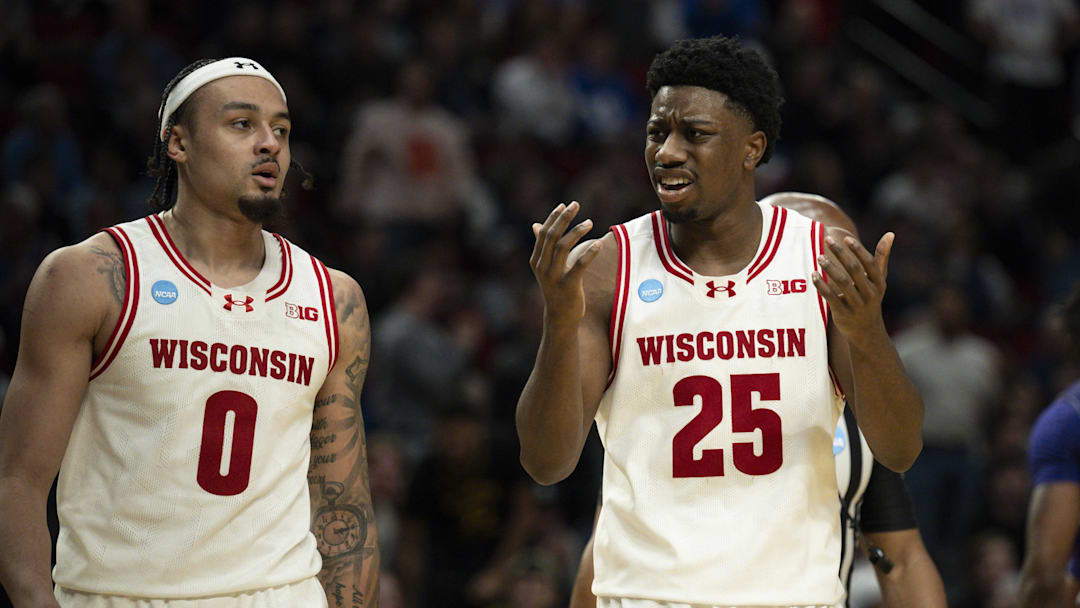 Mar 19, 2026; Portland, OR, USA; Wisconsin Badgers guard Braeden Carrington (0) and guard John Blackwell (25) react during the second half of a first round game of the men's 2026 NCAA Tournament against the High Point Panthers at Moda Center. Mandatory Credit: Troy Wayrynen-Imagn Images