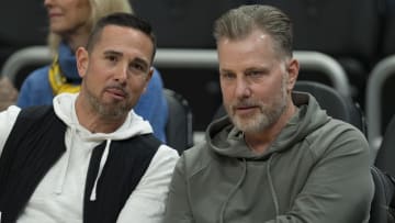 Mar 6, 2024; Milwaukee, Wisconsin, USA;  Green Bay Packers head coach Matt LaFleur and Chicago Bears head coach Matt Eberflus talk while sitting courtside prior to the game between the Connecticut Huskies and Marquette Golden Eagles at Fiserv Forum. Mandatory Credit: Jeff Hanisch-USA TODAY Sports