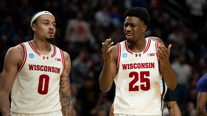 Mar 19, 2026; Portland, OR, USA; Wisconsin Badgers guard Braeden Carrington (0) and guard John Blackwell (25) react during the second half of a first round game of the men's 2026 NCAA Tournament against the High Point Panthers at Moda Center. Mandatory Credit: Troy Wayrynen-Imagn Images
