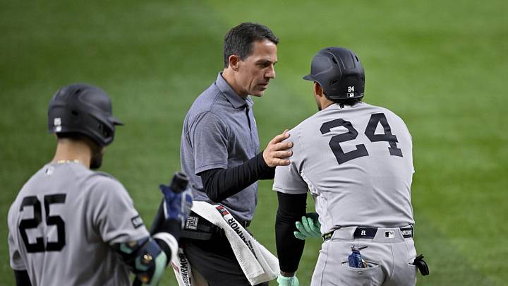 Apr 29, 2026; Arlington, Texas, USA; The New York Yankees team staff check on left fielder Jasson Dominguez (24) after he is hit by pitch during the fourth inning against the Texas Rangers at Globe Life Field. Mandatory Credit: Jerome Miron-Imagn Images