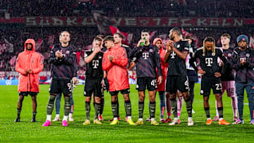Bayern Munich players celebrating win against FC Koln with the travelling fans.
