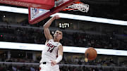 Apr 16, 2025; Chicago, Illinois, USA; Miami Heat guard Tyler Herro (14) dunks the ball against the Chicago Bulls during the second half at United Center. Mandatory Credit: David Banks-Imagn Images