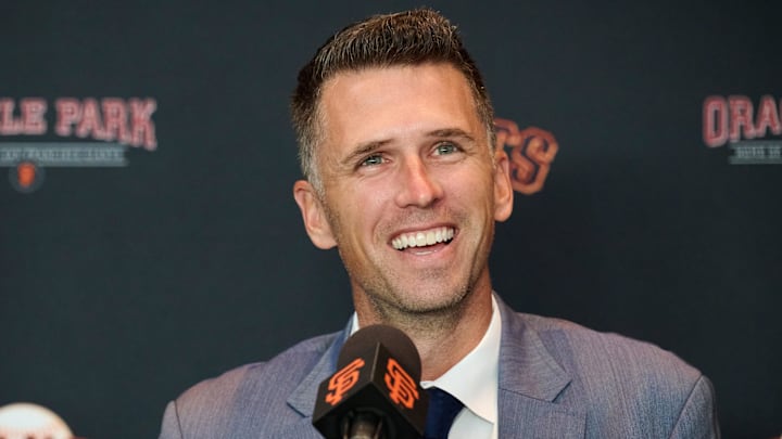 Oct 1, 2024; San Francisco, CA, USA; San Francisco Giants president of baseball operations Buster Posey reacts during an introductory press conference at Oracle Park.