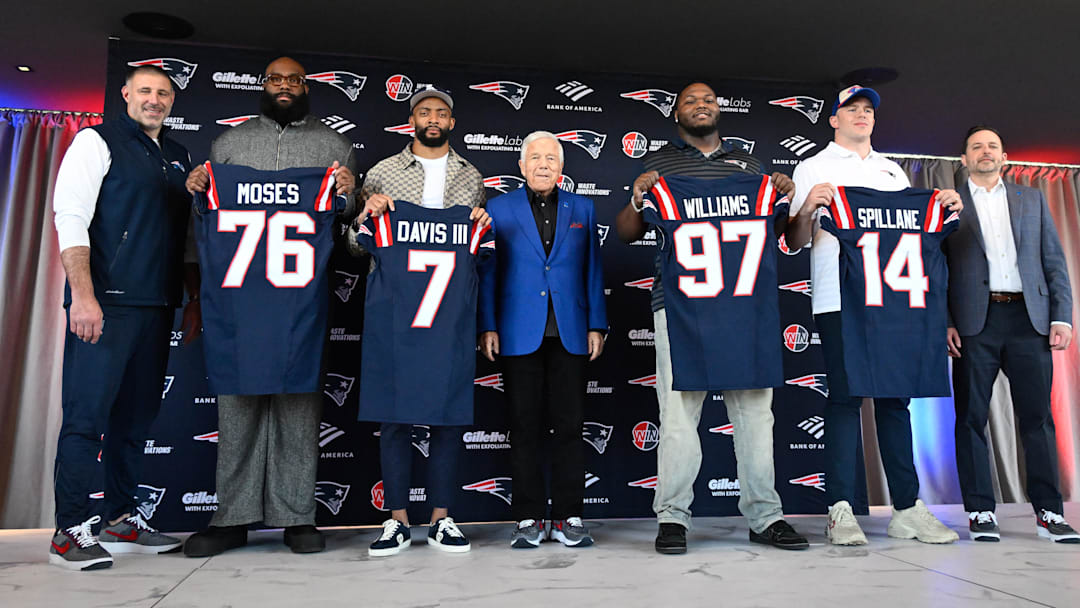 Mar 13, 2025; Foxborough, MA, USA; The New England Patriots hold a press conference at the GP Atrium at Gillette Stadium to introduce free agency additions to the team. (Left to right) New England Patriots head coach Mike Vrabel, offensive tackle Morgan Moses, cornerback Carlton Davis III, owner Robert Kraft, defensive tackle Milton Williams, linebacker Robert Spillane and executive vice president of player personnel Eliot Wolf.