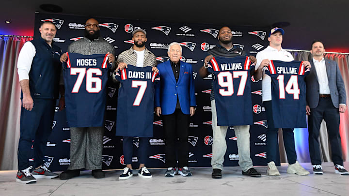 Mar 13, 2025; Foxborough, MA, USA; The New England Patriots hold a press conference at the GP Atrium at Gillette Stadium to introduce free agency additions to the team. (Left to right) New England Patriots head coach Mike Vrabel, offensive tackle Morgan Moses, cornerback Carlton Davis III, owner Robert Kraft, defensive tackle Milton Williams, linebacker Robert Spillane and executive vice president of player personnel Eliot Wolf.