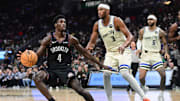 Nov 29, 2025; Milwaukee, Wisconsin, USA; Brooklyn Nets guard Drake Powell (4) looks for a shot against Milwaukee Bucks center Myles Turner (3) in the third quarter at Fiserv Forum. Mandatory Credit: Benny Sieu-Imagn Images