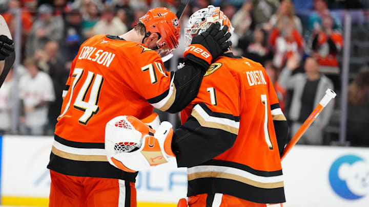 Apr 9, 2026; Anaheim, California, USA; Anaheim Ducks defenseman John Carlson (74) and goaltender Lukas Dostal (1) celebrate after the game at the Honda Center. Mandatory Credit: Kirby Lee-Imagn Images