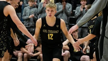 Mt. Vernon Marauders guard Luke Ertel (12) high fives teammates 