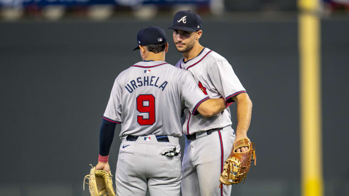 Atlanta Braves third baseman Gio Urshela (9) and first baseman Matt Olson