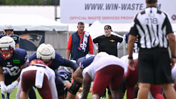 Aug 6, 2025; Foxborough, MA, USA; New England Patriots head coach Mike Vrabel (l) and Washington Commanders head coach Dan Quinn (r) watch over a special teams drill at a joint training camp at Gillette Stadium. Mandatory Credit: Eric Canha-Imagn Images
