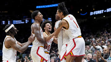 Maryland Terrapins center Derik Queen celebrates with teammates after scoring the game-winning shot against the Colorado State Rams at Climate Pledge Arena. 