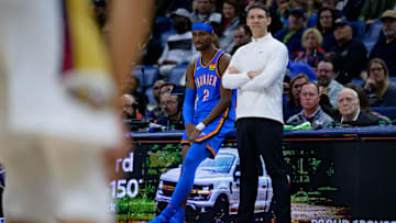 Dec 7, 2024; New Orleans, Louisiana, USA;  Oklahoma City Thunder head coach Mark Daigneault and Oklahoma City Thunder guard Shai Gilgeous-Alexander (2) watch the New Orleans Pelicans during the first half at Smoothie King Center. Mandatory Credit: Matthew Hinton-Imagn Images