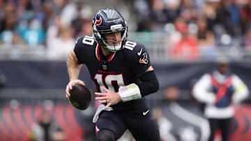 Nov 9, 2025; Houston, Texas, USA; Houston Texans quarterback Davis Mills (10) rolls out against the Jacksonville Jaguars during the first half at NRG Stadium. Mandatory Credit: Troy Taormina-Imagn Images
