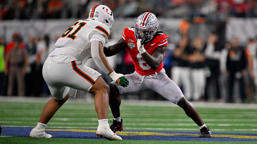 Dec 31, 2025; Arlington, TX, USA; Miami Hurricanes offensive lineman Francis Mauigoa (61) blocks Ohio State Buckeyes linebacker Arvell Reese (8) during the 2025 Cotton Bowl and quarterfinal game of the College Football Playoff at AT&T Stadium. Mandatory Credit: Jerome Miron-Imagn Images