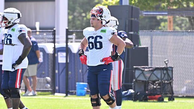 New England Patriots offensive tackle Will Campbell (66) takes a break during warm-ups.