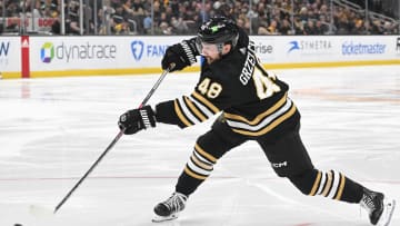 Feb 15, 2024; Boston, Massachusetts, USA; Boston Bruins defenseman Matt Grzelcyk (48) shoots the puck against the Seattle Kraken during the third period at the TD Garden. Mandatory Credit: Brian Fluharty-USA TODAY Sports