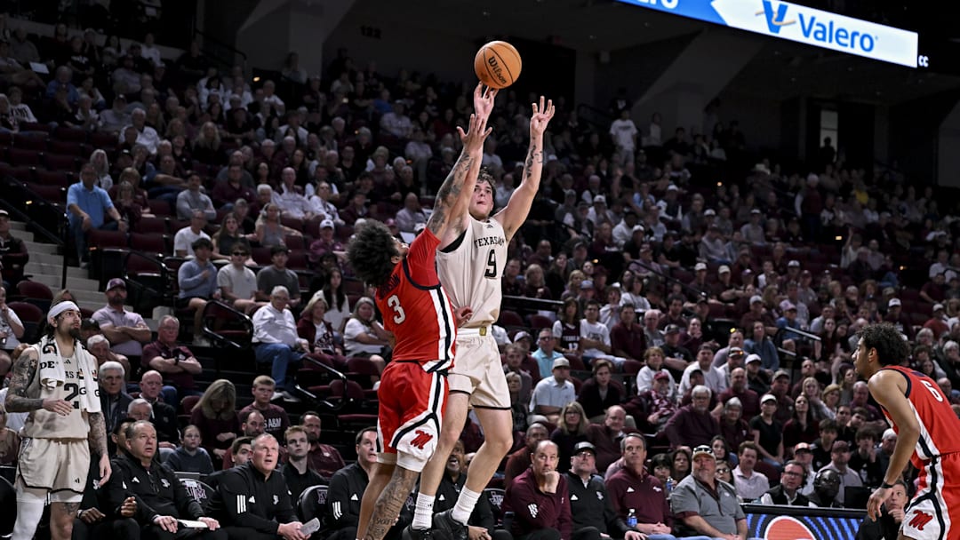 Feb 18, 2026; College Station, Texas, USA; Texas A&M Aggies guard Rubén Dominguez (9) shoots a three point basket as Ole Miss Rebels guard Koren Johnson (3) defends during the second half at Reed Arena. Mandatory Credit: Maria Lysaker-Imagn Images Feb 18, 2026; College Station, Texas, USA; Texas A&M Aggies guard Rubén Dominguez (9) shoots a three point basket as Ole Miss Rebels guard Koren Johnson (3) defends during the second half at Reed Arena. Mandatory Credit: Maria Lysaker-Imagn Images