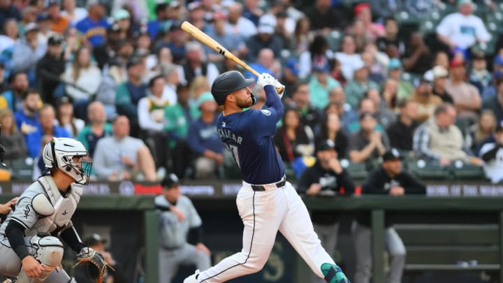 Seattle Mariners first baseman Tyler Locklear (27) hits a home run against the Chicago White Sox during the fifth inning at T-Mobile Park on June 13.