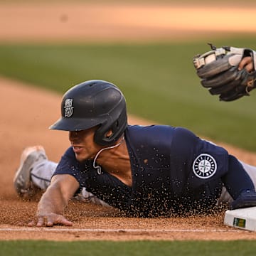 Seattle Mariners shortstop Leo Rivas steals third base during a game against the Oakland Athletics on Monday at Oakland Coliseum.