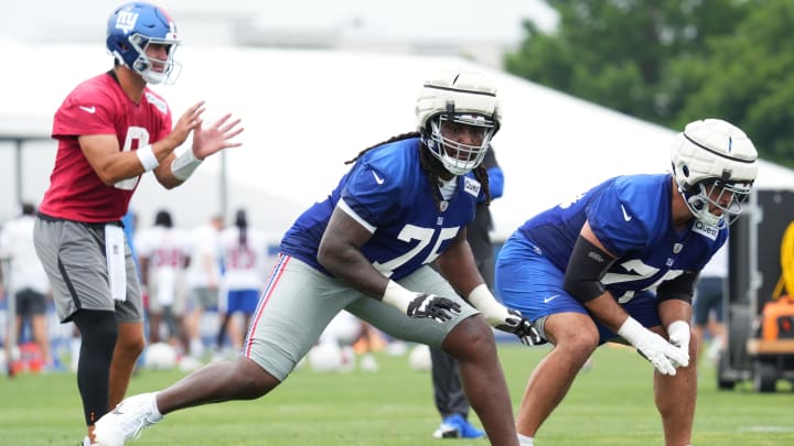 Jul 25, 2024; East Rutherford, NY, USA; New York Giants offensive tackle Joshua Ezeudu (75) participates in a drill during training camp at Quest Diagnostics Training Center.  