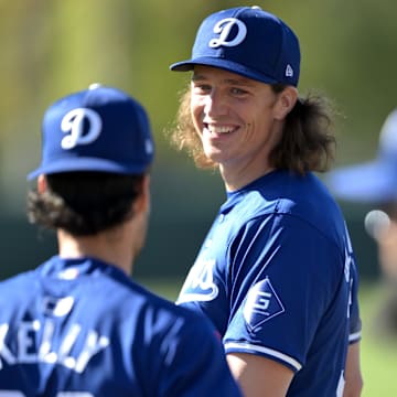 Feb 17, 2024; Glendale, AZ, USA;  Los Angeles Dodgers starting pitcher Tyler Glasnow (31) talks with relief pitcher Joe Kelly (99) during spring training at Camelback Ranch. Mandatory Credit: Jayne Kamin-Oncea-Imagn Images