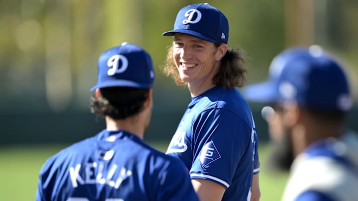 Feb 17, 2024; Glendale, AZ, USA;  Los Angeles Dodgers starting pitcher Tyler Glasnow (31) talks with relief pitcher Joe Kelly (99) during spring training at Camelback Ranch. Mandatory Credit: Jayne Kamin-Oncea-Imagn Images