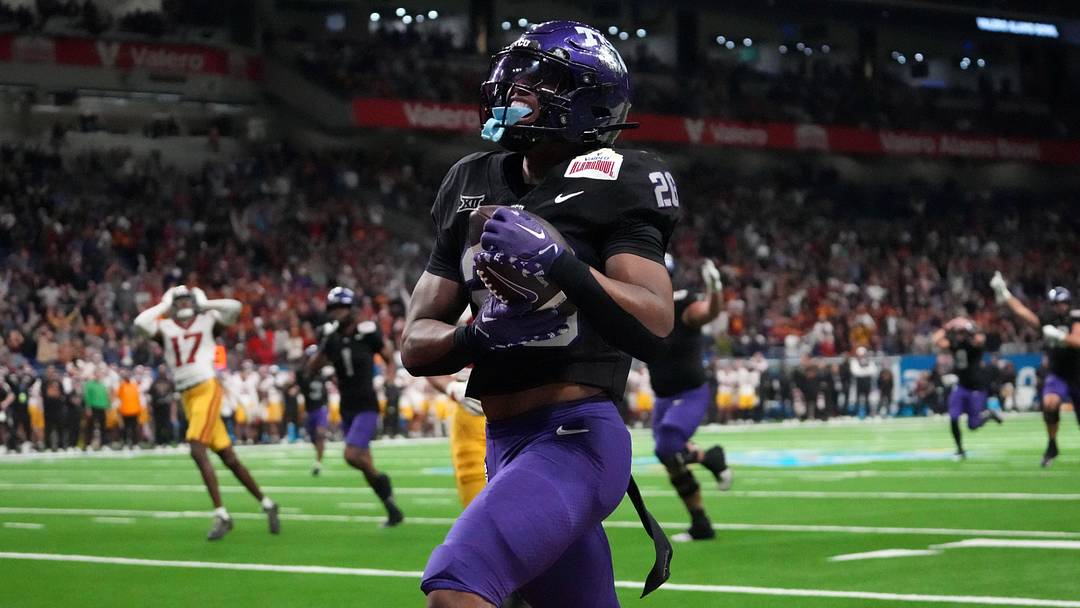 Dec 30, 2025; San Antonio, TX, USA; TCU Horned Frogs running back Jeremy Payne (26) scores on a 35-yard touchdown reception in overtime for the winning score against the Southern California Trojans during the Alamo Bowl at Alamodome. Mandatory Credit: Kirby Lee-Imagn Images