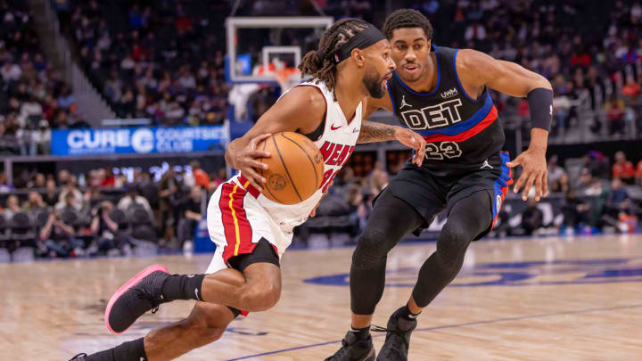 Mar 15, 2024; Detroit, Michigan, USA; Miami Heat guard Patty Mills (88) drives to the basket next to Detroit Pistons guard Jaden Ivey (23): David Reginek-USA TODAY Sports