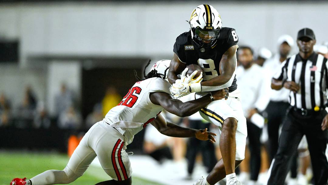 Sep 5, 2026; Nashville, Tennessee, USA;  Vanderbilt Commodores tight end Jayvontay Conner (8) leaps while running the ball against Austin Peay Governors defensive back Quan Peterson (9) during the second half at FirstBank Stadium.  Mandatory Credit: Steve Roberts-Imagn Images