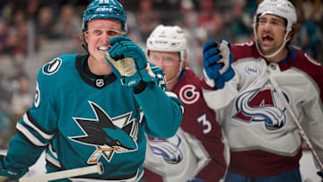 Oct 20, 2024; San Jose, California, USA; San Jose Sharks left wing Fabian Zetterlund (20) and Colorado Avalanche left wing Miles Wood (28) react during a stoppage of play in the second period at SAP Center at San Jose. Mandatory Credit: Robert Edwards-Imagn Images