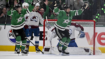 Apr 28, 2025; Dallas, Texas, USA; Dallas Stars left wing Jamie Benn (14) and center Wyatt Johnston (53) celebrate as a shot by defenseman Thomas Harley (not pictured) falls behind the back of Colorado Avalanche goaltender Mackenzie Blackwood (39) during the first period in game five of the first round of the 2025 Stanley Cup Playoffs at American Airlines Center. Mandatory Credit: Jerome Miron-Imagn Images